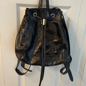 Black leather backpack purse.
